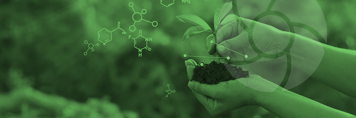 Hands holding soil with plant biology chemical symbols with a light logo overlay.